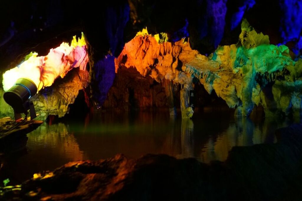 Explore the illuminated limestone caverns of Makido Cave