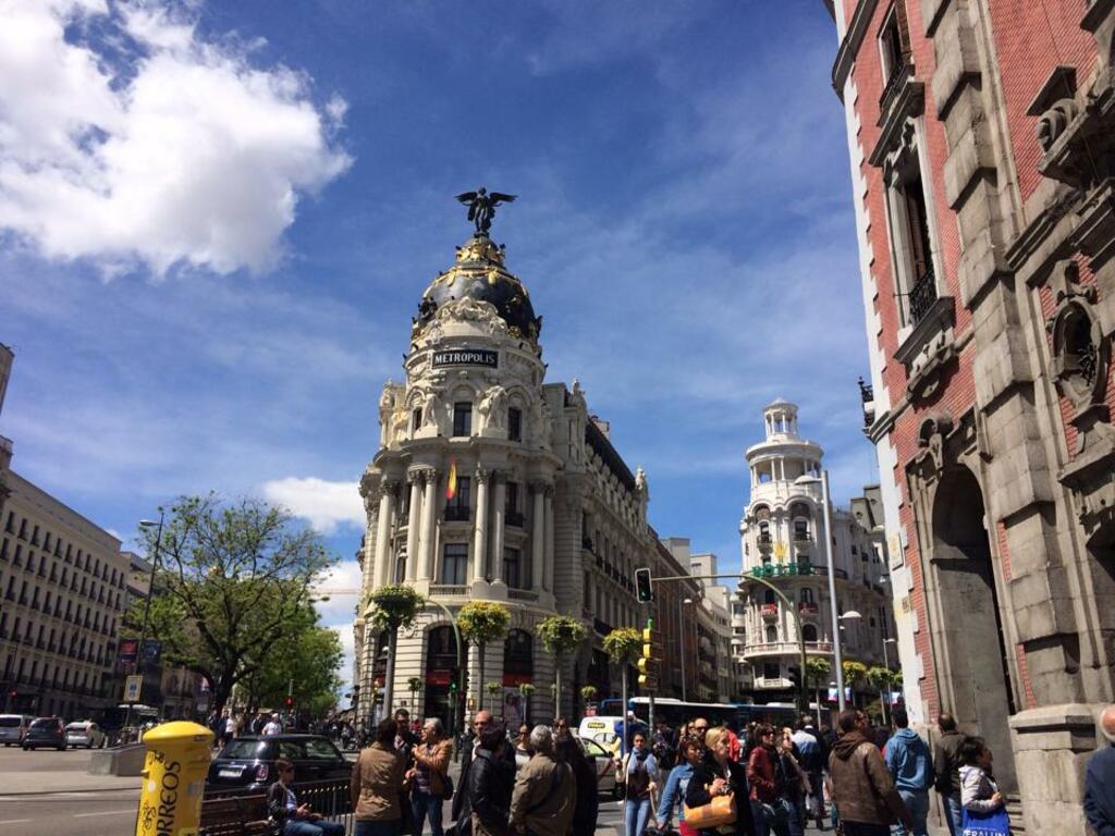 take a walk through the gran via, madrid's busiest street