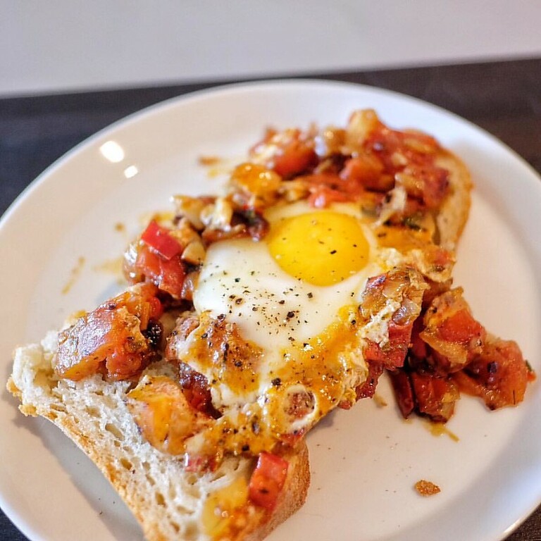 Shakshuka straight up, atop fresh baked cheese bread. #eats