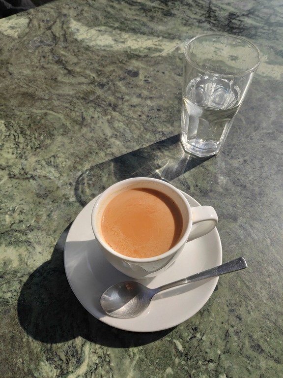 Milk tea and a glass of water