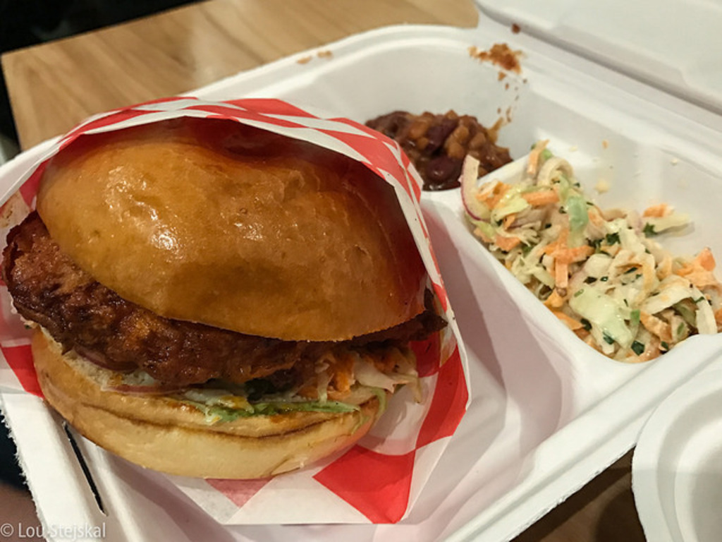 The Budlong - Hot: Hot Chicken Sandwich on Brioche, roasted garlic aioli, farm slaw, pickels, pit beans ($12)