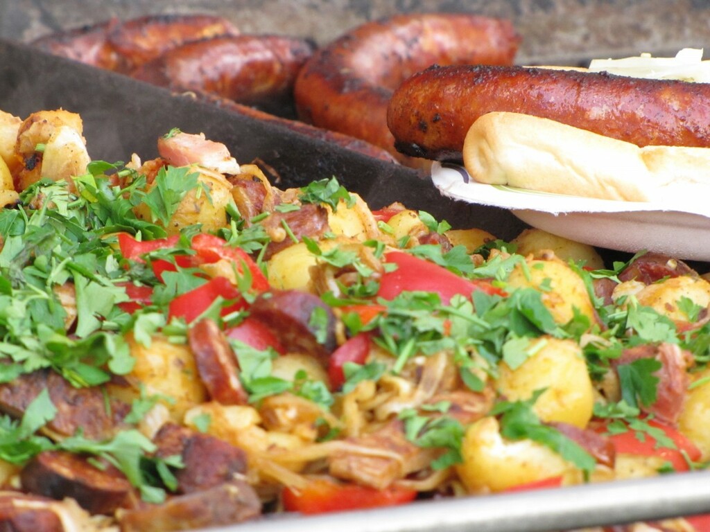 Urutan sausage served with a salad