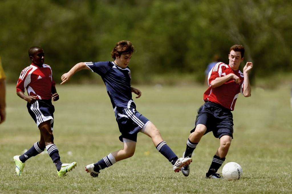 Youth Enjoying a Game of Soccer