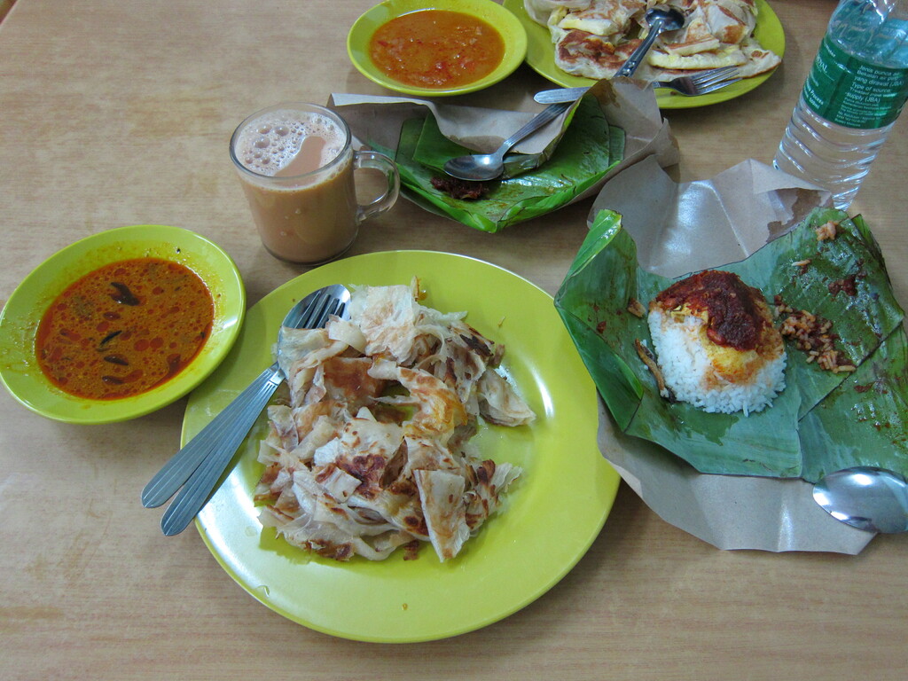My breakfast - 2 roti canai, nasi lemak, and a teh tarik