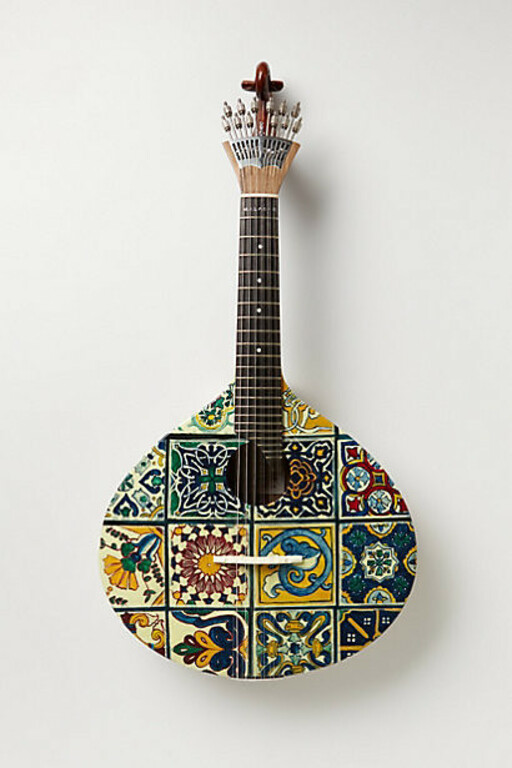 Tiled Fado Guitar by andreabolivar8 liked from a luxurious wicker sofa.