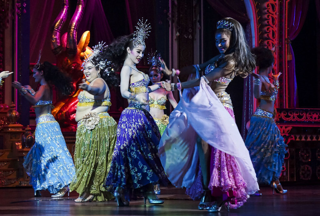 Ladyboys in colorful costumes performing on stage at the Alkazar Cabaret in Pattaya-47