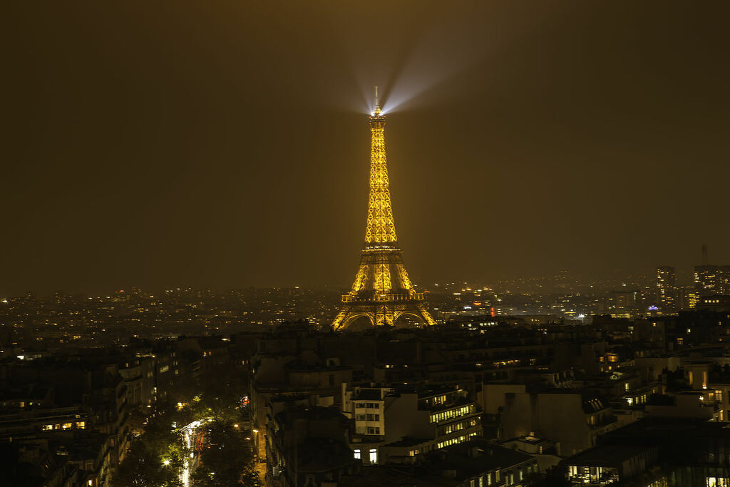 Eiffel Tower in cityscape of Paris at night light (8210912882)