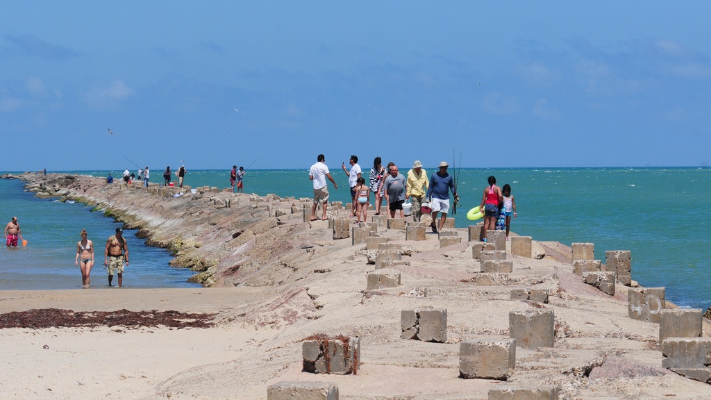 People on breakwater at Isla Blanca Park, South Padre Island, Texas