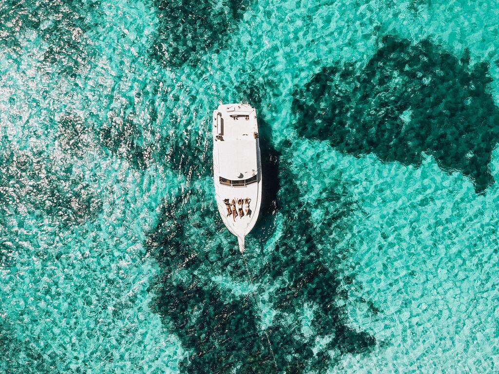 white boat on water