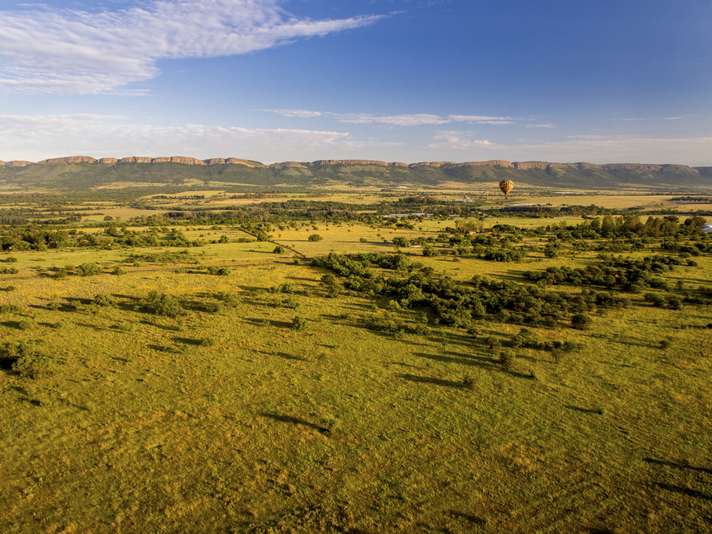 must-do things in south africa | soar high in a hot air ballooning at magalies river valley