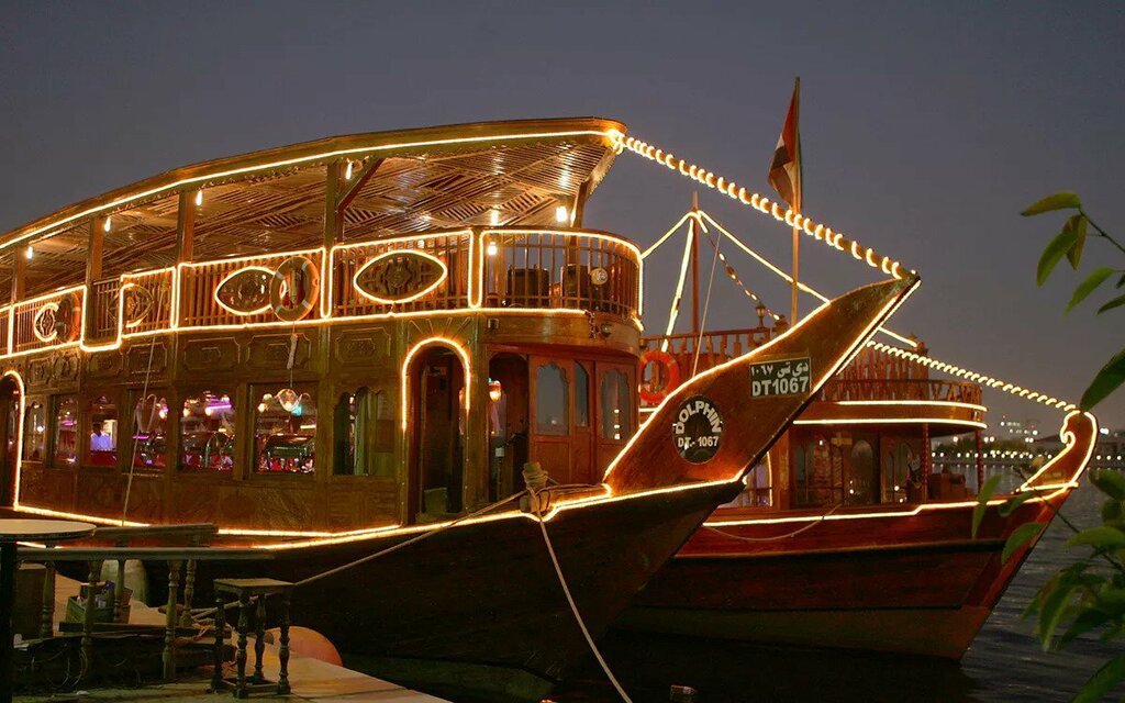 enjoy a dhow dinner cruise with live entertainment in dubai creek
