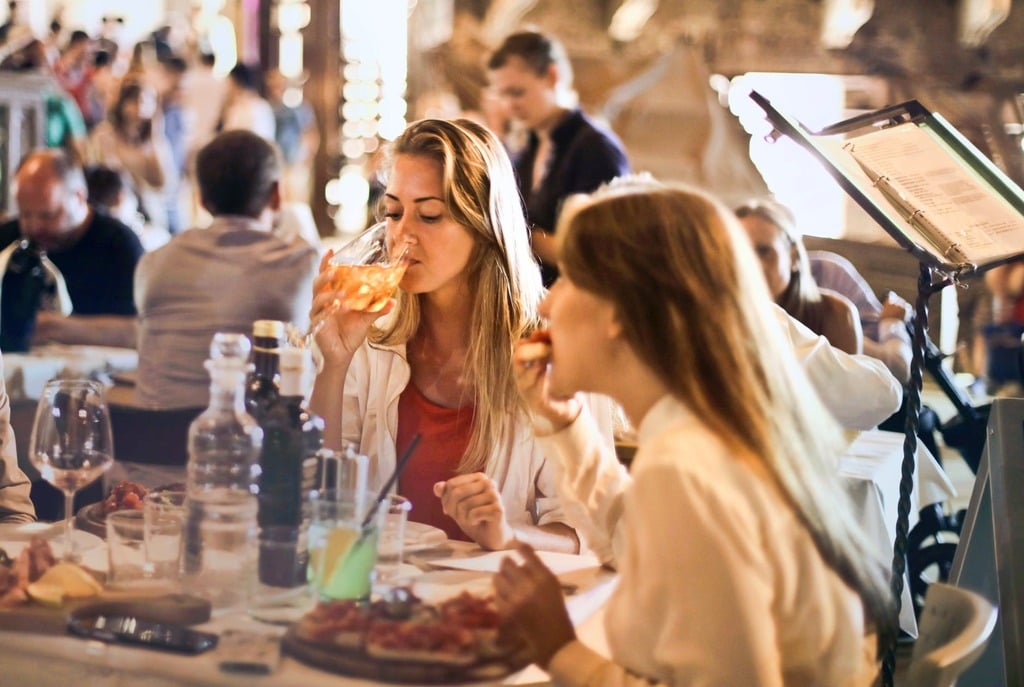 Woman drinking at a restaurant